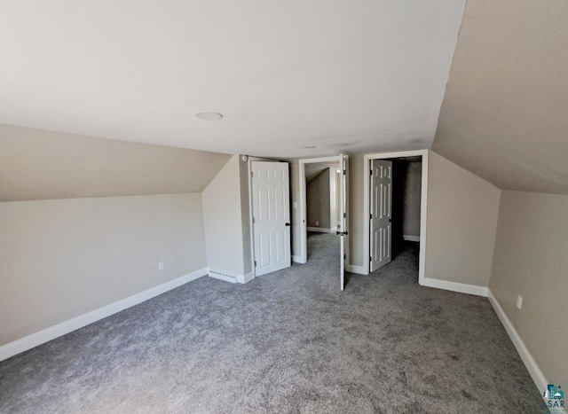 bonus room featuring carpet flooring and vaulted ceiling