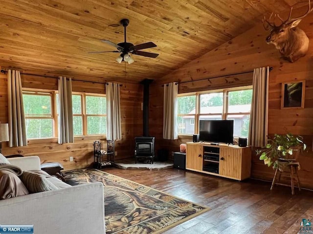 living area with a healthy amount of sunlight, wood walls, wood ceiling, and wood-type flooring