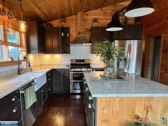 kitchen with lofted ceiling, wooden ceiling, appliances with stainless steel finishes, a sink, and backsplash