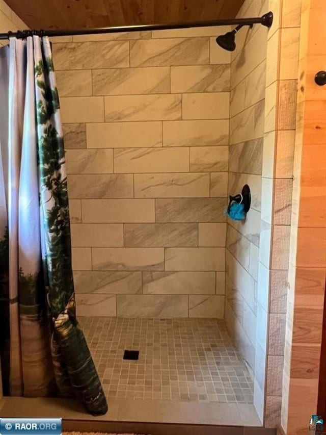 full bathroom with a tile shower