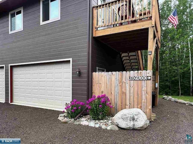 view of side of home featuring an attached garage