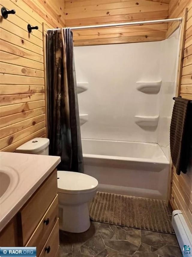 bathroom with wooden walls, baseboard heating, and vanity