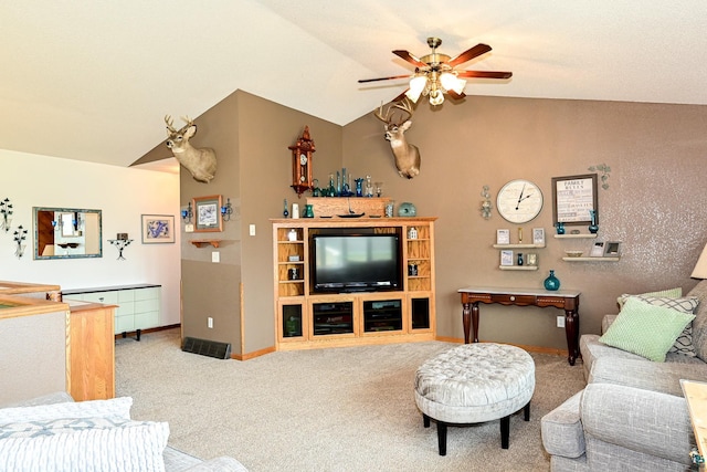 carpeted living room with lofted ceiling and ceiling fan