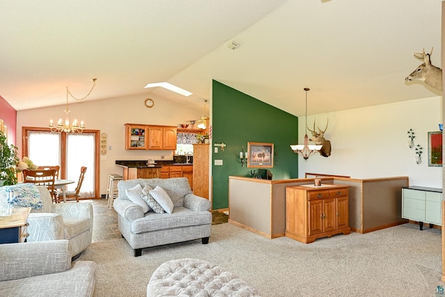 living room with light colored carpet, vaulted ceiling with skylight, and an inviting chandelier