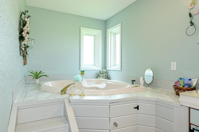 bathroom featuring a bathtub and vanity