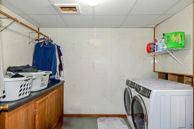 washroom with washer and dryer