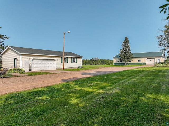 view of front facade featuring a garage and a front lawn