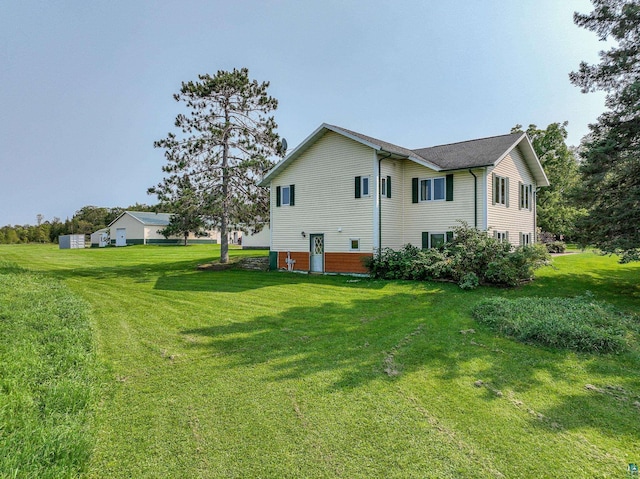 view of home's exterior with a yard