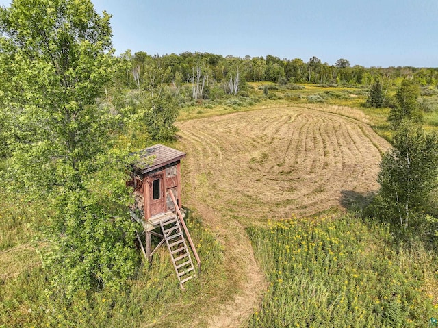 birds eye view of property with a rural view