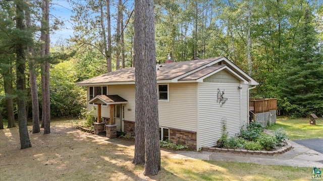 view of property exterior featuring a deck