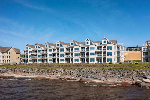 view of building exterior with a water view