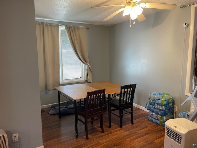 dining space featuring ceiling fan, a textured ceiling, and dark hardwood / wood-style flooring