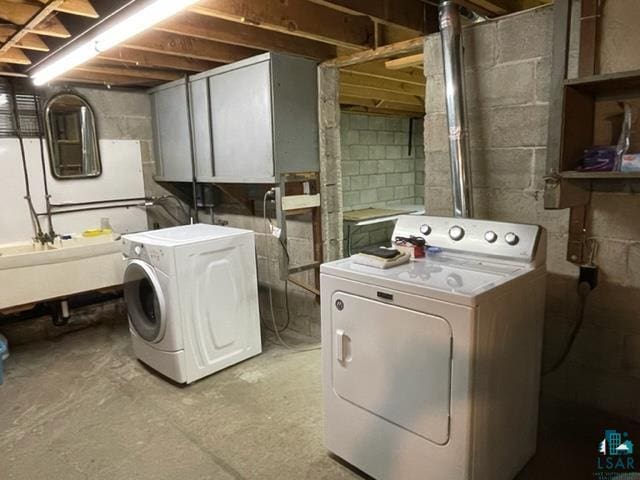 laundry area with washing machine and dryer