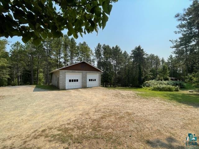 exterior space with an outbuilding and a garage