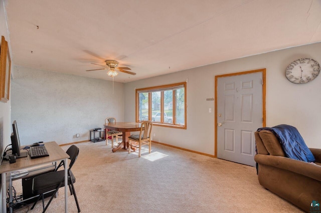 interior space featuring light colored carpet and ceiling fan