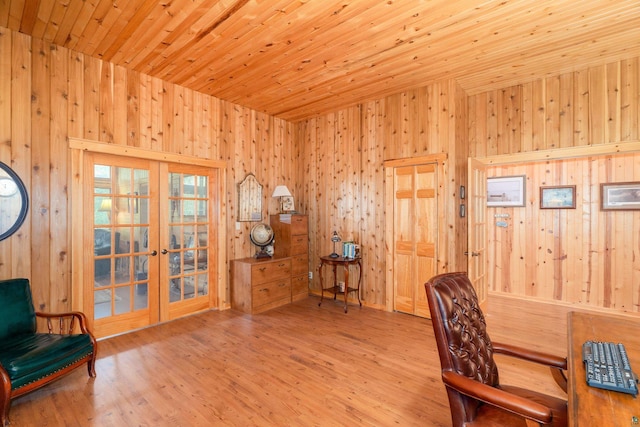 home office featuring wooden ceiling, french doors, hardwood / wood-style floors, and wooden walls