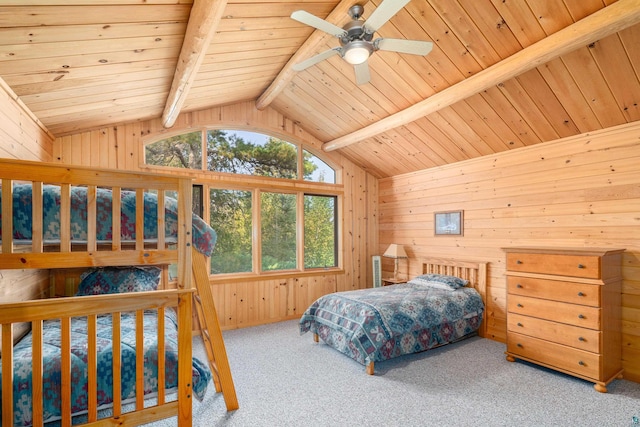 carpeted bedroom featuring wood ceiling, ceiling fan, wood walls, and lofted ceiling with beams