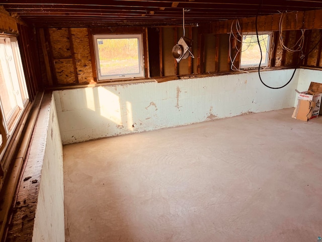 unfurnished room with concrete floors