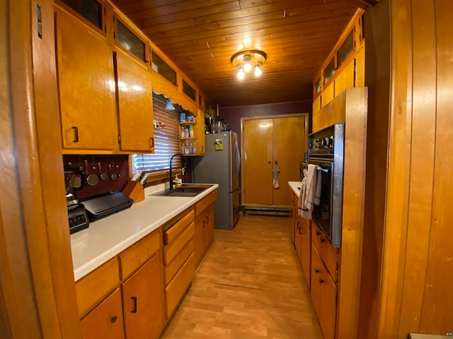 kitchen with light hardwood / wood-style floors, wood ceiling, dishwasher, oven, and sink