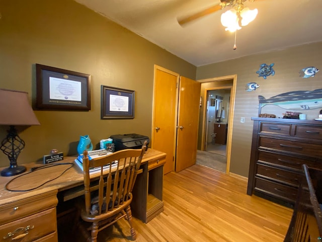 office featuring light hardwood / wood-style floors and ceiling fan