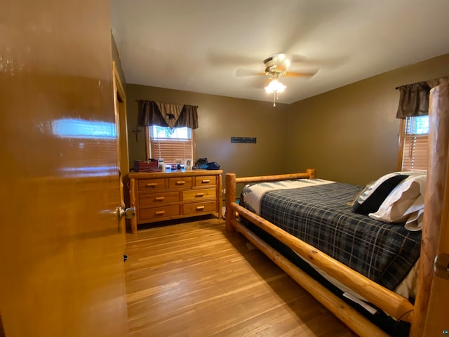 bedroom featuring light hardwood / wood-style floors and ceiling fan