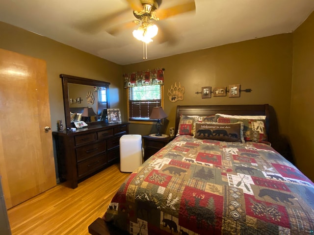 bedroom featuring light hardwood / wood-style flooring and ceiling fan