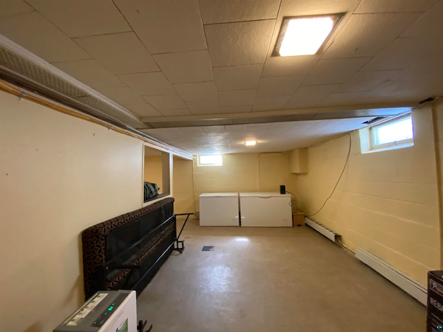 basement with a baseboard heating unit