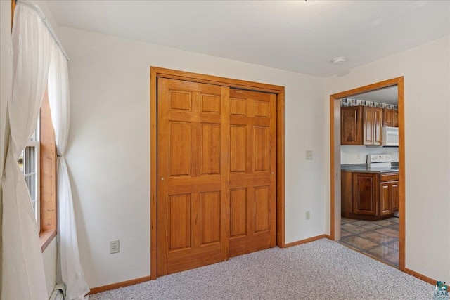 unfurnished bedroom with light colored carpet