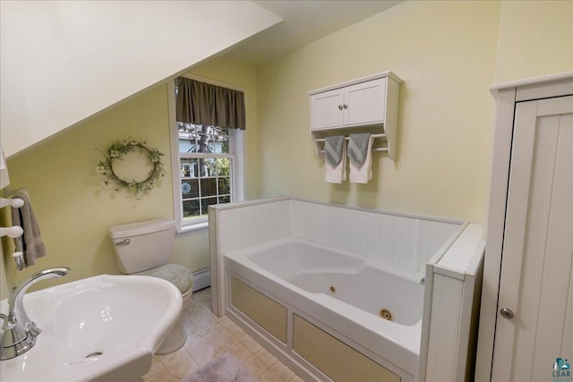 bathroom with a washtub, tile patterned flooring, toilet, and a baseboard heating unit