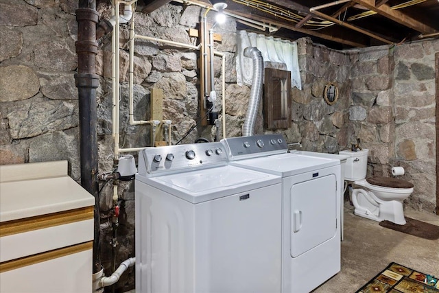 clothes washing area featuring independent washer and dryer