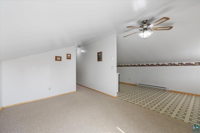 additional living space featuring ceiling fan, light colored carpet, a baseboard radiator, and vaulted ceiling