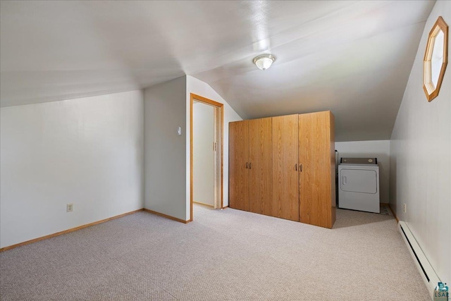 bonus room featuring lofted ceiling, washer / dryer, baseboard heating, and light colored carpet