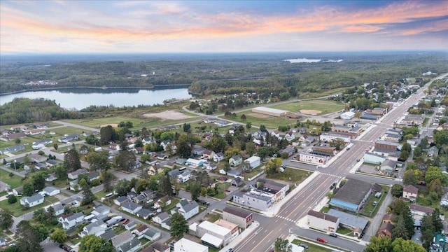 aerial view at dusk with a water view