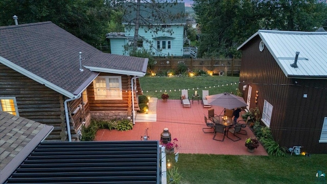 exterior space with a lawn and a patio area