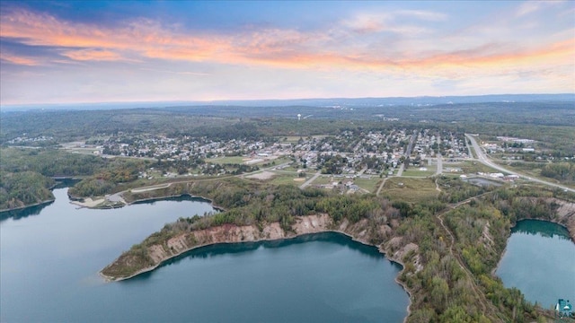 aerial view at dusk with a water view