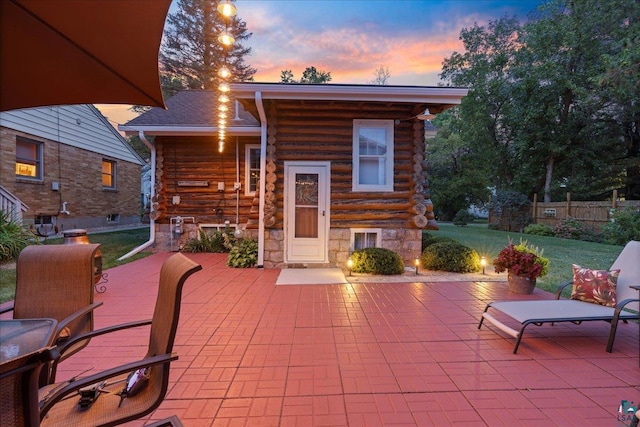 patio terrace at dusk with a yard