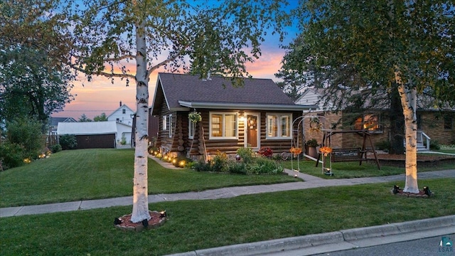 view of front of home with a lawn