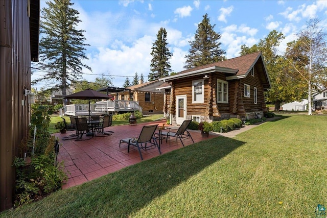 back of house featuring a yard and a patio area