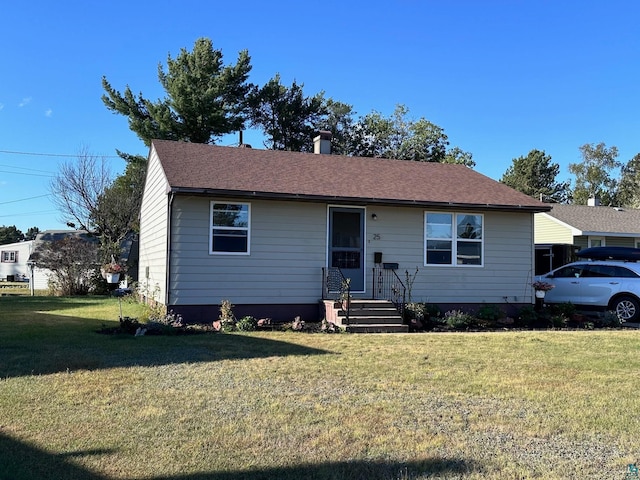 view of front of house with a front lawn