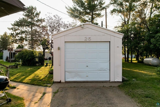 garage featuring a yard