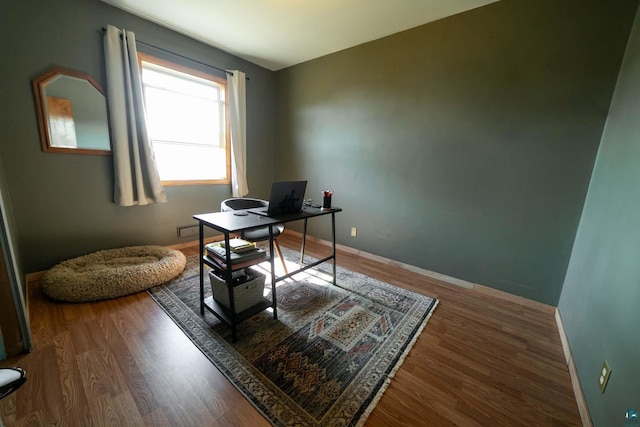 office space with dark hardwood / wood-style floors