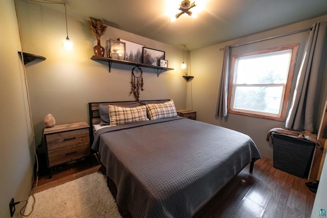 bedroom with wood-type flooring