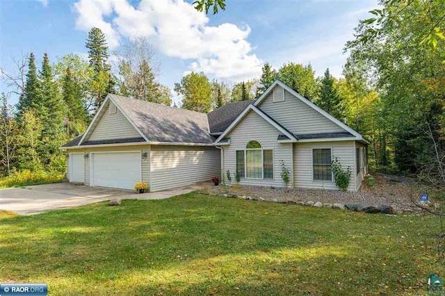 view of front facade with a front lawn and a garage