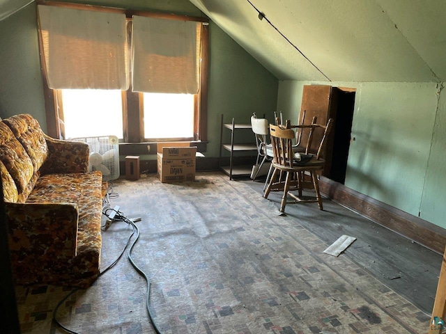 living area with lofted ceiling and carpet