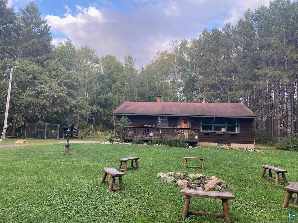 view of yard featuring a wooden deck