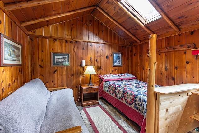 bedroom featuring vaulted ceiling with skylight, wood walls, and wooden ceiling