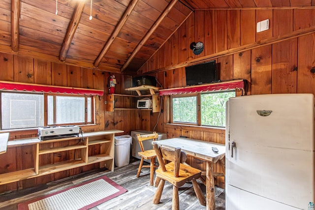 interior space featuring wooden walls, lofted ceiling, hardwood / wood-style flooring, and wooden ceiling