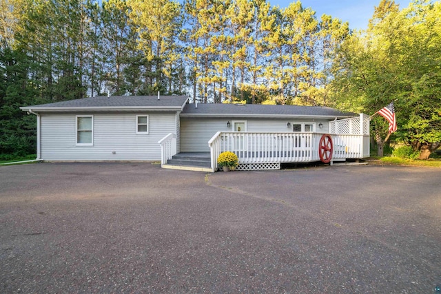 ranch-style home featuring a deck