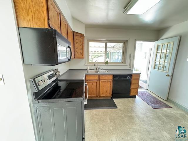 kitchen featuring sink and black appliances