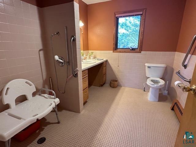 bathroom with tile walls, tile patterned flooring, vanity, and toilet